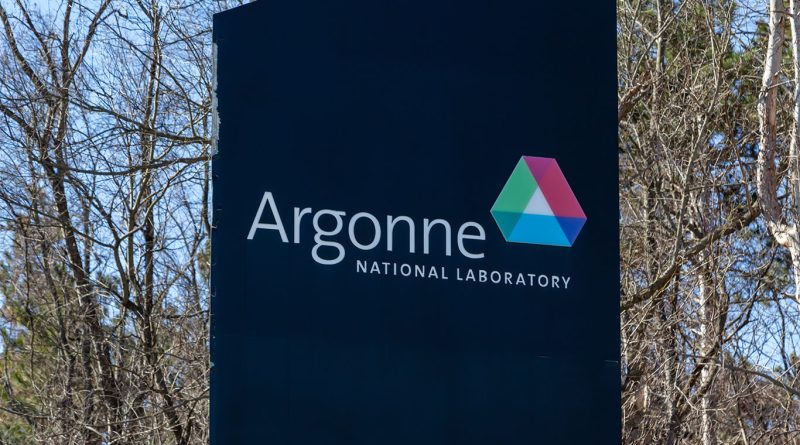 Image of a large sign outside near some trees displaying the Argonne National Laboratory logo