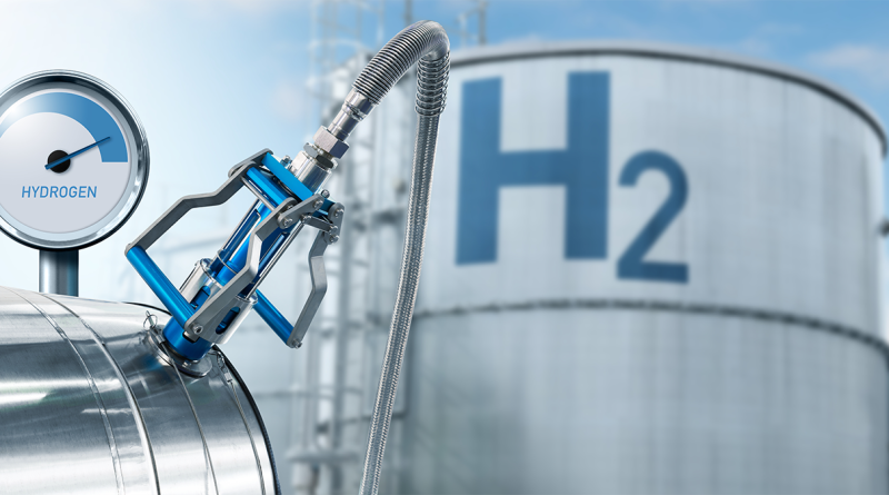 Image of a large hydrogen tank outside with a meter and funnel going into it to support hydrogen powered article