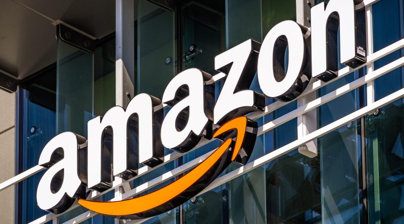 Amazon logo on warehouse to support AI energy data-center article