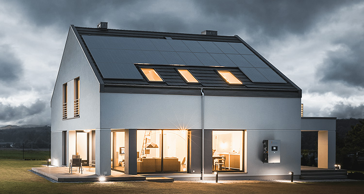 House with solar panels on the ruuf under brooding skies