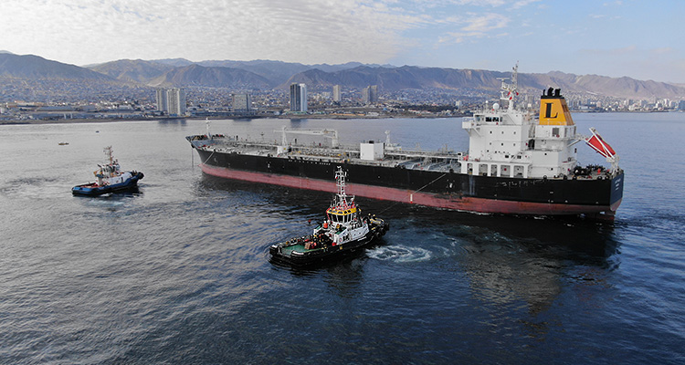 Tugs Maneuvering a tanker in a port