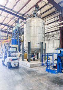 a large stainless steel mixing vessel