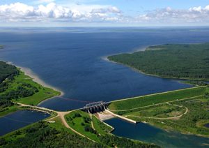 Aerial shots of the spillway and floating debris barrier of the second hydroelectric dam, Francois-Finlay Dam (1986) constructed on Codette Lake and the Saskatchewan River near the Nipawin; river basin bridge and roadsCopyright 2010 Ron Garnett / AirScapes.ca
