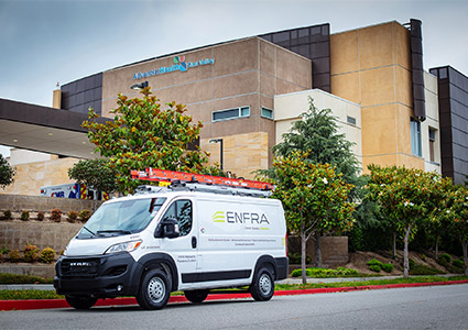 ENFRA branded van outside building