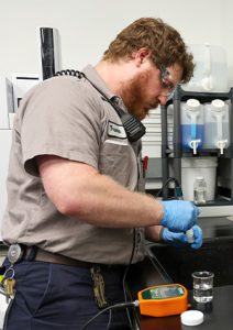 a person using a portable gas detector