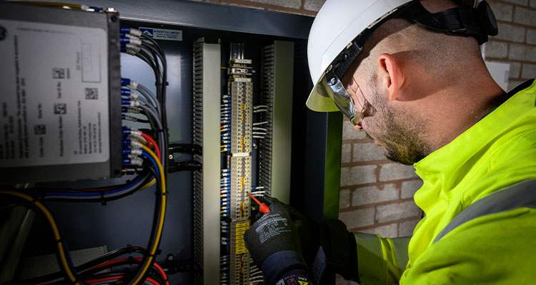 Part of Matrix Group, Matrix Networks’ end-to-end utility solutions bring complex infrastructure projects to life an engineer working on the internal components of a fibre cabinet
