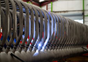 helical coil or a section of a heat exchanger coil during its fabrication