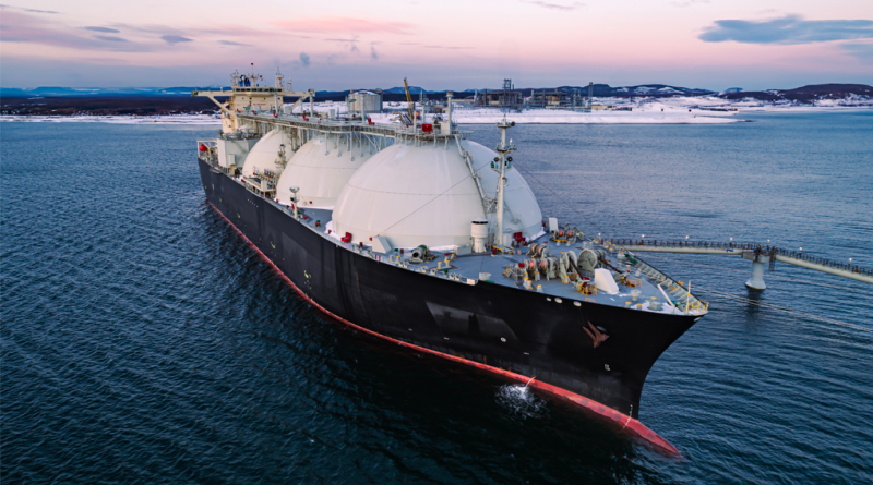 Aerial of Liquified Natural Gas LNG carrier moored to a small gas terminal