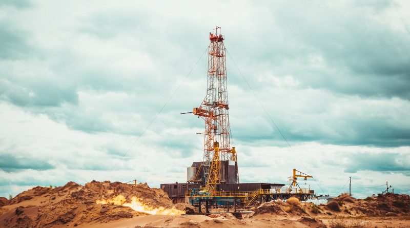 Digital oilfield control room displaying AI-powered upstream oil and gas analytics