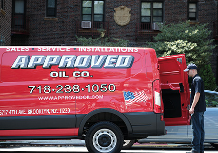 a red service van belonging to Approved Oil Co., a long-running family-owned energy and heating contractor based in New York City