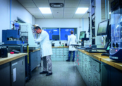 two scientists working in a modern, well-equipped laboratory environment.