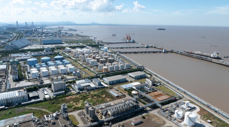 Oil storage tanks and crude oil infrastructure illustrating China's growing influence on global energy markets through strategic petroleum reserves.