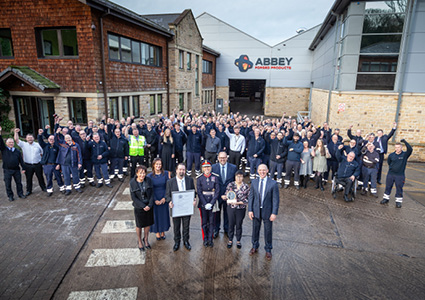 a large group of employees gathered outside Abbey Forged Products