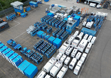 a yard stocked with Aggreko temporary industrial cooling units