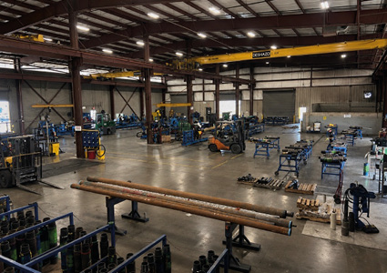  large industrial warehouse or metal fabrication workshop with concrete floors, steel-frame construction
